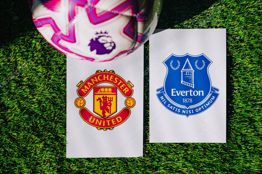 VIENNA, AUSTRIA, MAY 26, 2025: Manchester United vs Everton derby football match in Premier League. Club logo and official ball on green soccer grass.