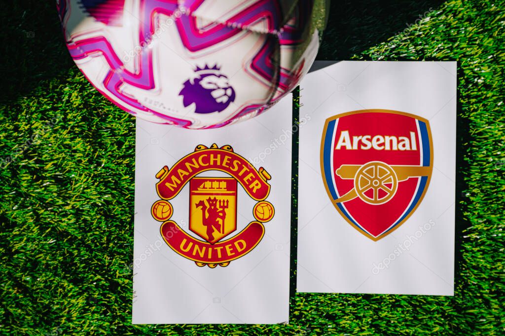 VIENNA, AUSTRIA, MAY 26, 2025: Manchester United vs Arsenal derby football match in Premier League. Club logo and official ball on green soccer grass.