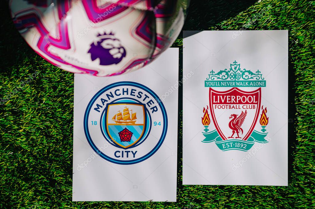 VIENNA, AUSTRIA, MAY 26, 2025: Manchester City vs Liverpool derby football match in Premier League. Club logo and official ball on green soccer grass.