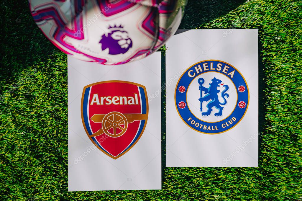 VIENNA, AUSTRIA, MAY 26, 2025: Arsenal vs Chelsea derby football match in Premier League. Club logo and official ball on green soccer grass.