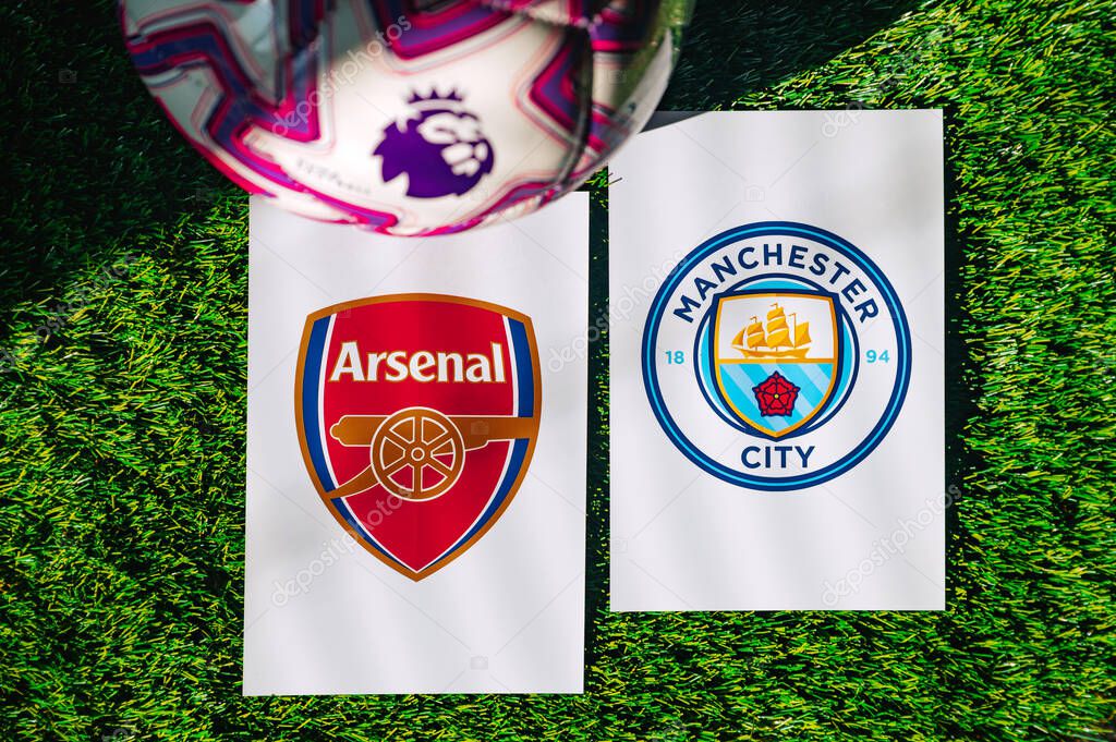 VIENNA, AUSTRIA, MAY 26, 2025: Arsenal vs Manchester City derby football match in Premier League. Club logo and official ball on green soccer grass.