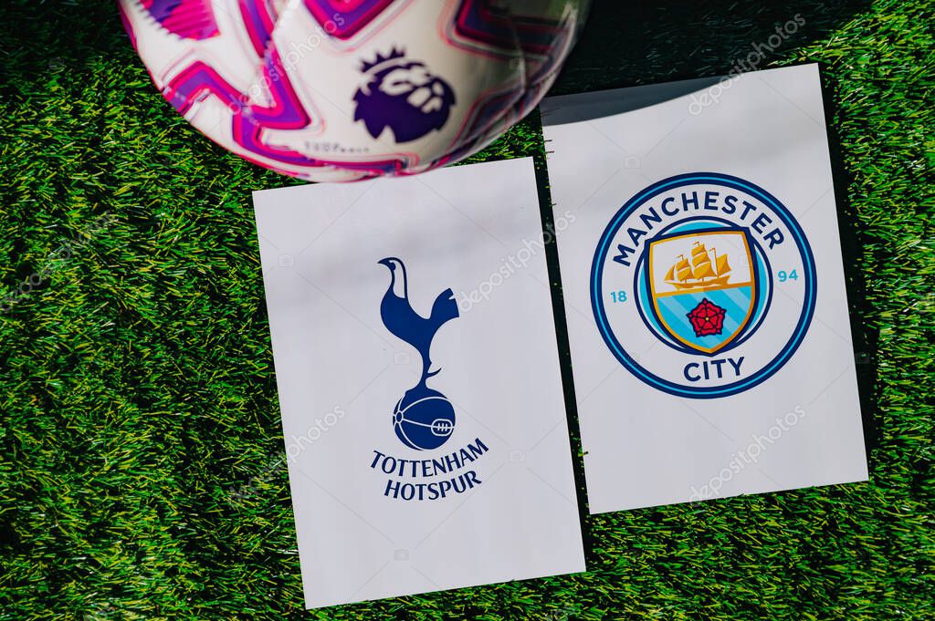 VIENNA, AUSTRIA, MAY 26, 2025: Tottenham Hotspur vs Manchester City derby football match in Premier League. Club logo and official ball on green soccer grass.