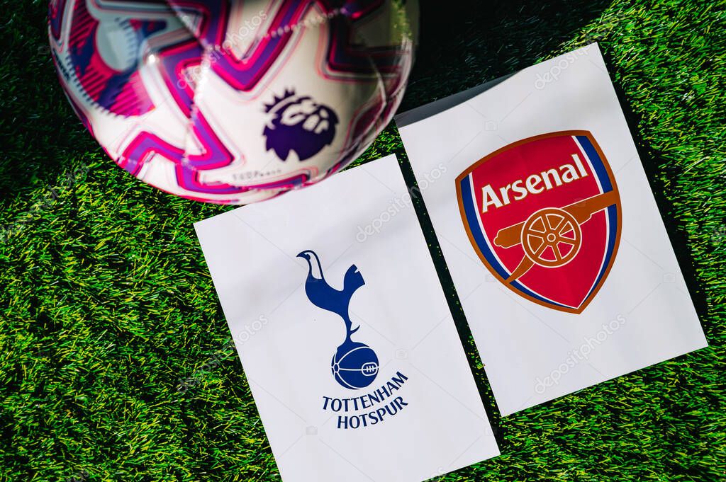 VIENNA, AUSTRIA, MAY 26, 2025: Tottenham Hotspur vs Arsenal derby football match in Premier League. Club logo and official ball on green soccer grass.
