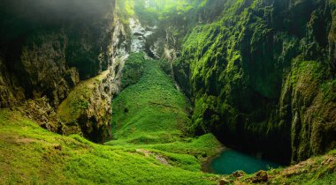 Macocha Abyss, Moravian Karst microclimate with juicy greenery and a small lake. clipart