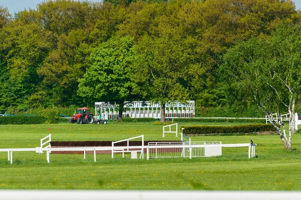 Starting line on the racetrack with obstacles for horses. — Stock Photo, Image