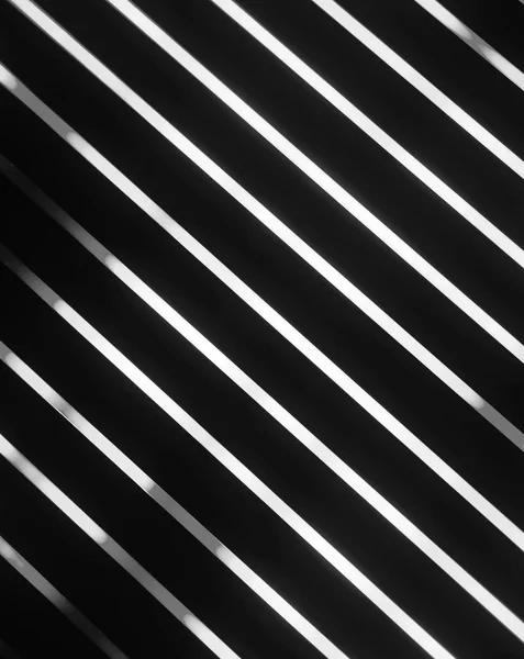 black and white glowing lines on black background