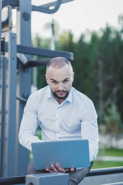 man using a portable computer