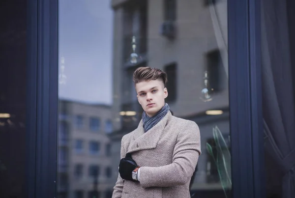 Handsome young man in coat