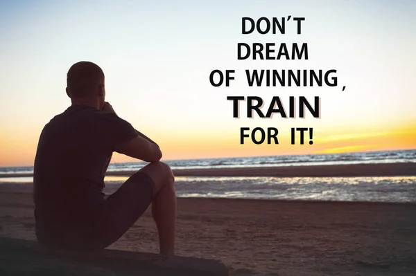 Don't dream of winning train for it. Sad lonely man sits and thinking on beach. Inspirational motivating quote. Multicolored outdoors horizontal image