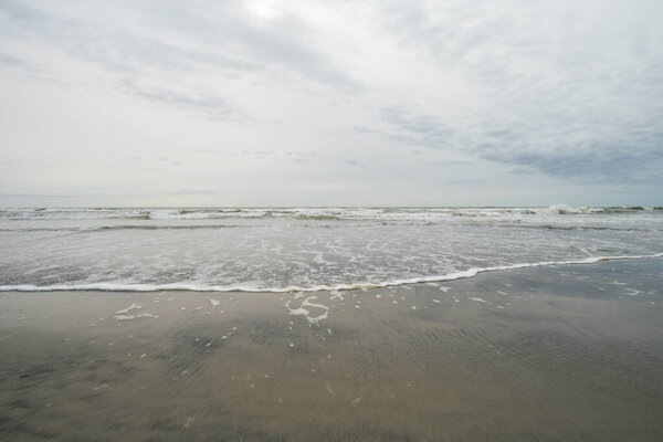 A View of the Horizon Over the Ocean on the Beach on a Cloudy Grey Sky