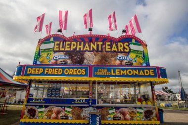 Cheboygan, Michigan, USA - August 9, 2018: Fair concessions booth at the Cheboygan County Fair in northern Michigan. clipart