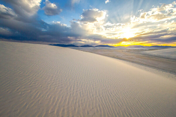 Gorgeous Desert Sunset Landscape. Sunset over the desert horizon of the White Sands National Monument near Alamogordo, New Mexico. Horizontal orientation with no people and copy space in the foreground.