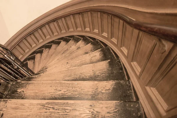 Spiral Staircase Background. Antique wooden spiral staircase shot from above in horizontal orientation.