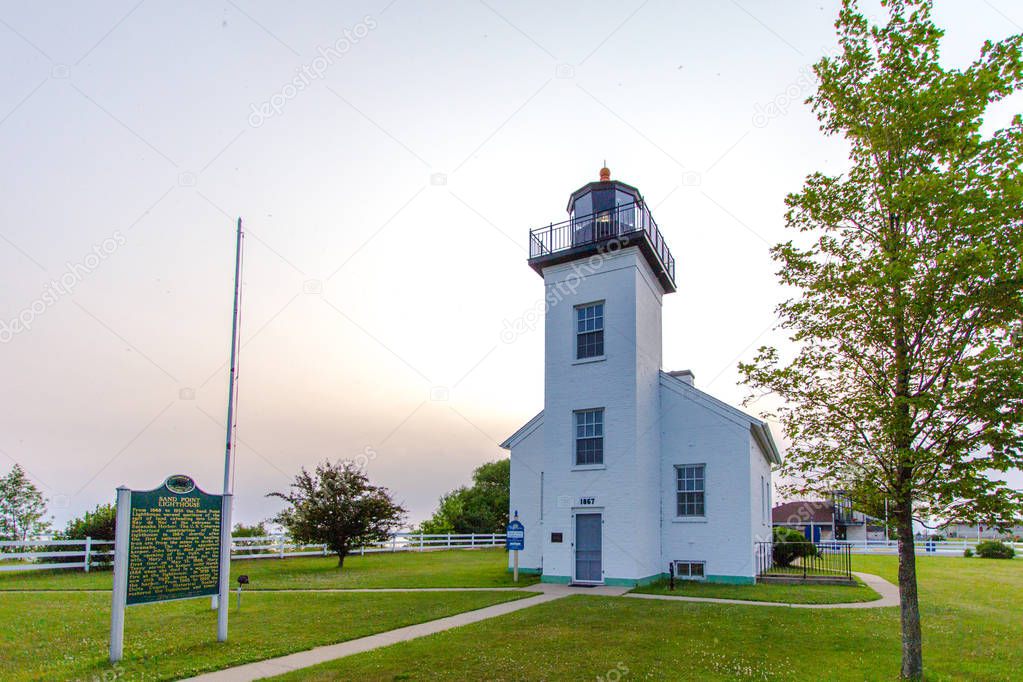Historic Lake Michigan Lighthouse. Sand Point Lighthouse on the coast of Lake Michigan at Ludington Park in downtown Escanaba.