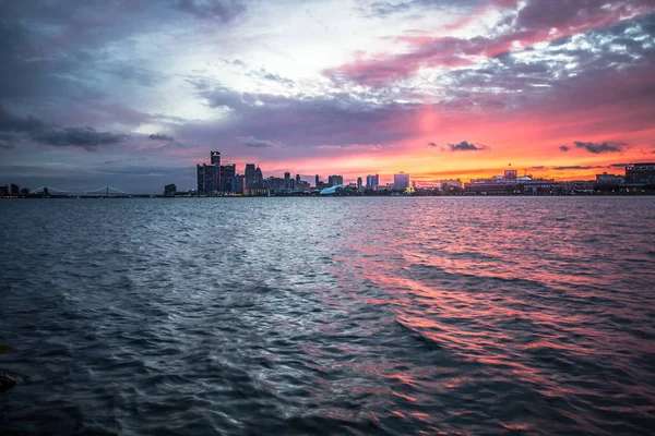 Skyline Of Detroit Michigan. Panoramic city skyline of downtown Detroit Michigan at sunset as seen from Belle Isle State Park.