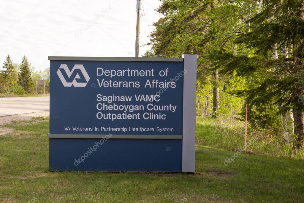 Mackinaw City, Michigan, USA -  May 30, 2020: Sign for the an outpatient VA Clinic in rural northern Michigan.
