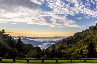 Great Smoky Mountains Sunset Panorama. Sunset at a roadside overlook on the Newfound Gap Road of the Great Smoky Mountains National Park in Gatlinburg, Tennessee. clipart