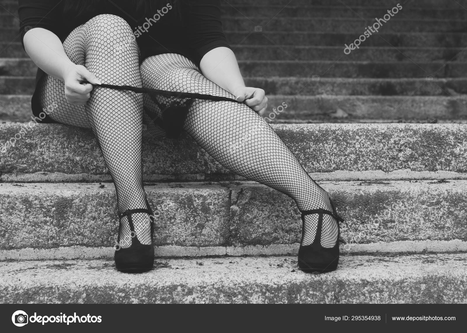 Sexy woman wearing fishnet stockings Stock Photo by ©Funkenschlag 295354938