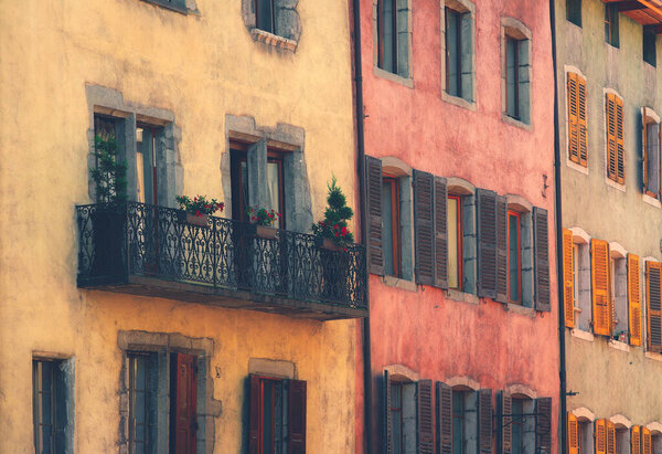 A colorful building and windows in the old town of Annecy in France