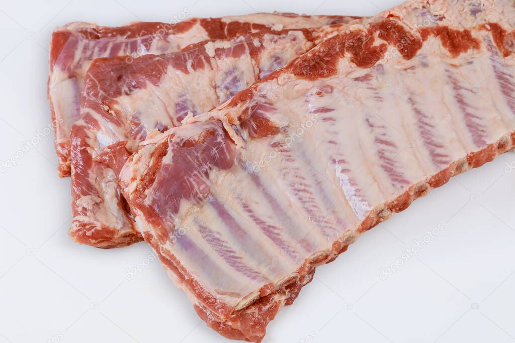 Fresh pork ribs isolated against on white background.