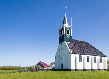 Old village church Oudeschild on Texel island in the Netherlands clipart