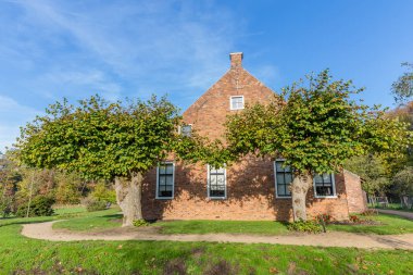 Traditional Dutch farmhouse scene clipart