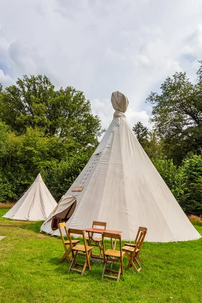 Colorful campsite with wigwam tents — Stock Photo, Image