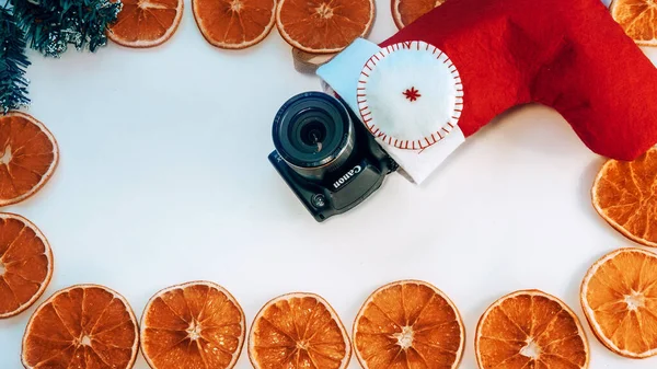 dried orange peel dried orange frame on white background. space for text.the view from the top. copy space. top view. dried orange peel. Holiday, celebration and cooking concept. new year and christmas postcard.Christmas sock gifts. photo, camera