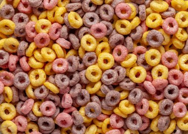 Çocukların kahvaltısı. Mısır gevreği döngüsü arka planı. Yakın plan.