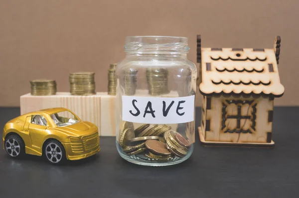 gold coins in a jar with money. Real estate investment concept, home insurance, auto loan. Housing and car savings plans