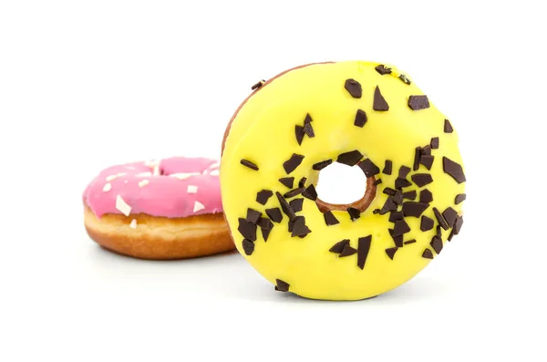 Zwei Süße Donuts Rosa Und Gelber Glasur Und Mit Schokoladenstreusel — Stockfoto