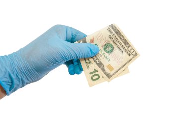 bir eldiven içinde 10 dolarlık bir banknot tutar / beyaz / kopya boşluğunda izole edilir.