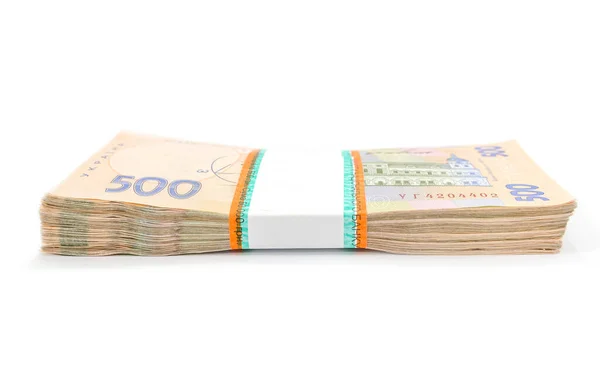Beyaz arka planda izole edilmiş bir yığın Ukrayna parası, 500 Hryvnia. Para konsepti. Bir sürü banknot. Yan görünüm.