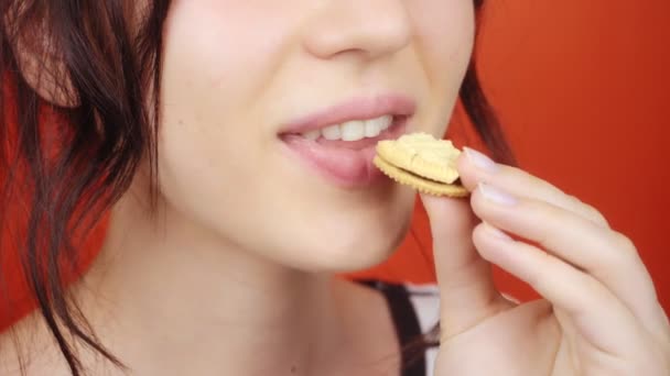 Young Girl Gorgeous Lips Bright Red Background Woman Eating Small — Stock Video