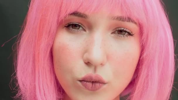 Woman Pink Hair Looks Blinks Quickly Childish Naive Look Dark — Stock Video