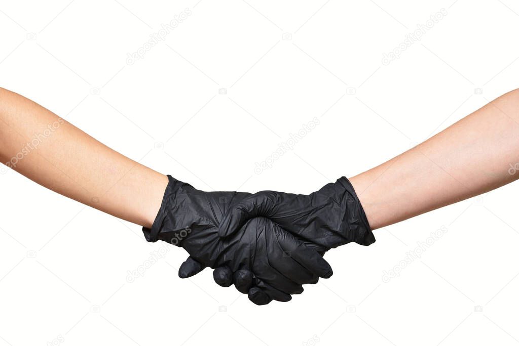 Two women greeting and handshake in protective black gloves on white background