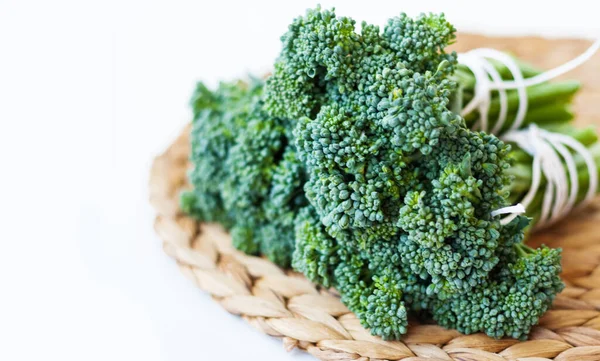 Bunch Raw Fresh Broccolini Wicker Straw Stand White Background Vegetarian — Stock Photo, Image