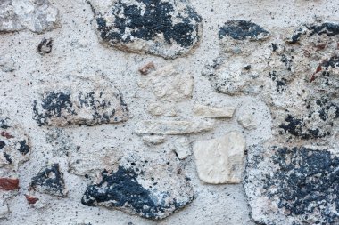 Eski bir binanın taş duvarının dokusu, antik mimari.