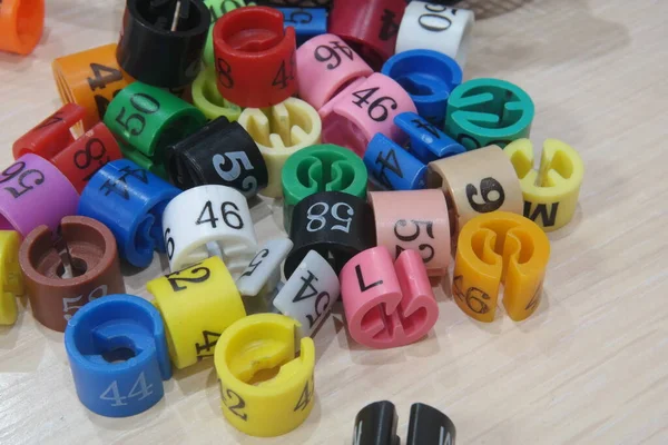 colorful plastic toys.close up of many colored button.euro currency symbol.colorful baby shoes.colorful plastic beads