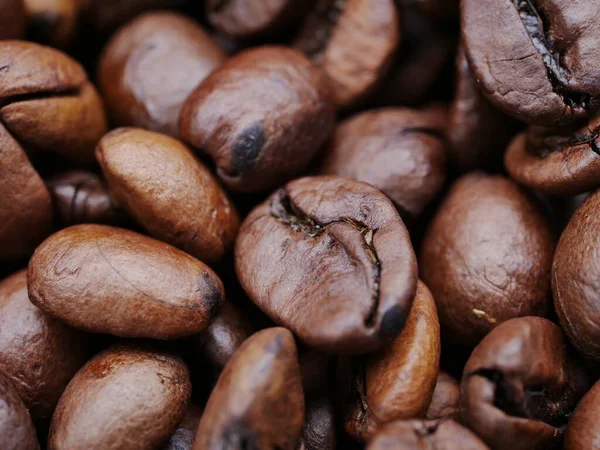 close up of a coffee maker.coffee beans background