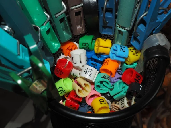 colorful plastic toys.old fashioned objects.pile of colorful tires.still life with colored pencils.kitchen still life