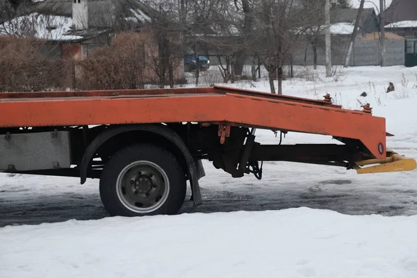 Tow truck in the winter on the road