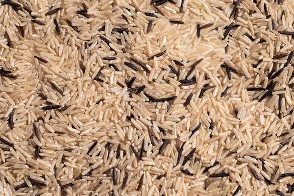 A mixture of wild and unpolished rice close up texture