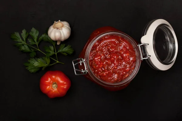 Tomato Sauce Glass Jar Branch Parsley Fresh Tomatoes Garlic Black — Stock Photo, Image