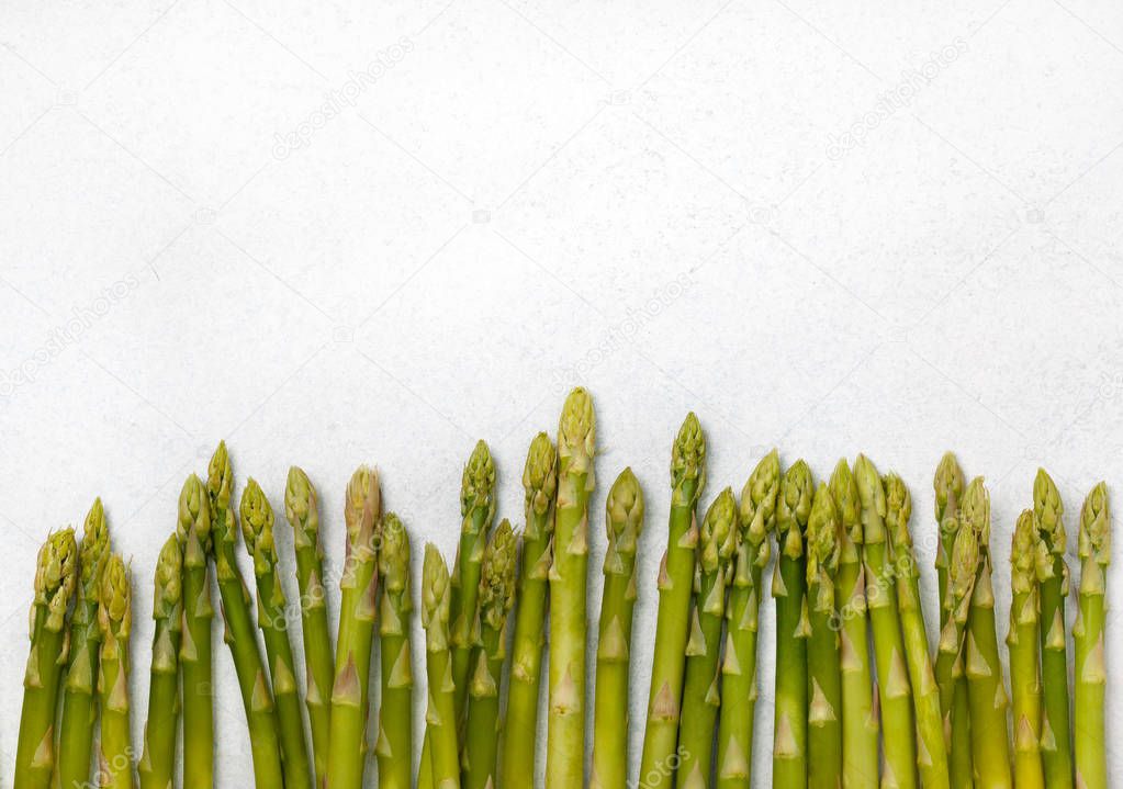 fresh asparagus sprouts on a light background close up