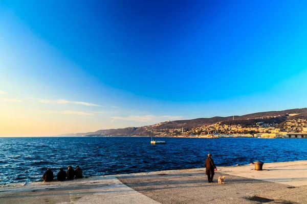 Colorful sunset in front of the city of Trieste — Stock Photo, Image