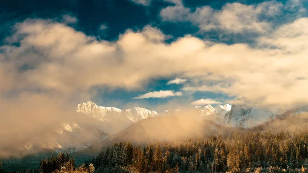 Mangart capped by the fog in a winter day — Stock Photo, Image