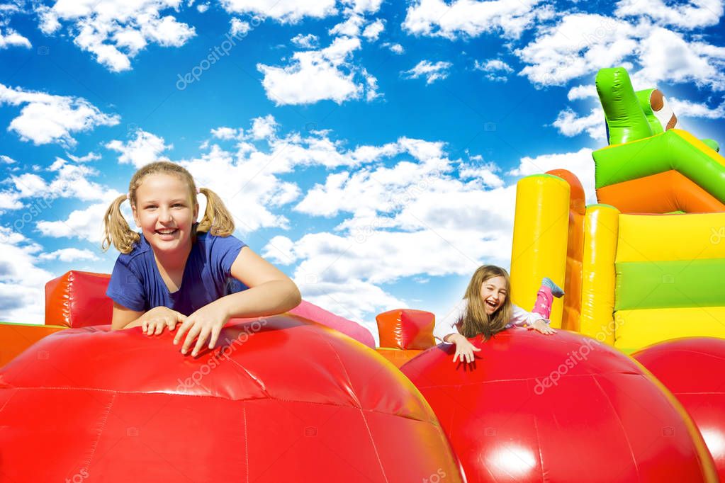 Happy Girls on Inflate Castle