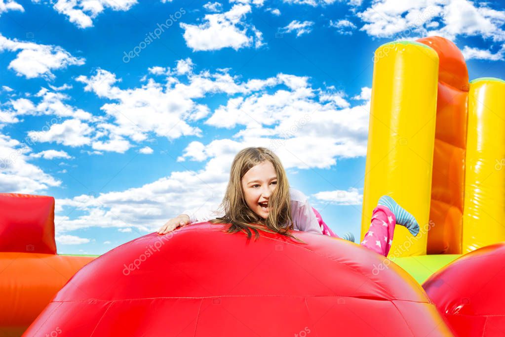 Happy Girl Child on Inflate Castle Cloudscape