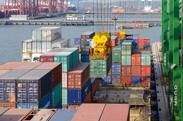 Nhava Sheva, India - March 09: Discharge of the ship on the berth in port of Nhava Sheva on March 09, 2018 in Nhava Sheva, India.